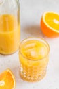 Fresh orange juice with ice cubes in a glass Royalty Free Stock Photo