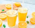 Fresh orange Juice and oranges on the cutting board Royalty Free Stock Photo