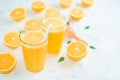 Fresh orange Juice and oranges on the cutting board Royalty Free Stock Photo