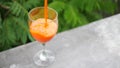 Fresh orange juice in pouring glass. Healty detox footage hd slowmotion.