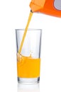 Fresh orange juice pouring into glass on white background Royalty Free Stock Photo