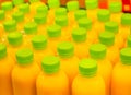 Fresh orange or lemon juice packed in plastic bottles ready to drink. Royalty Free Stock Photo