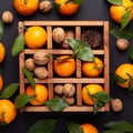 Fresh orange mandarins, tangerine with green leaves in wooden box. Top view Royalty Free Stock Photo