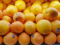 Fresh orange oranges with supermarket labels