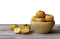 Fresh orange organic ripe Fuyu Persimmons or Persimon fruits Kaki in wooden bowl