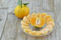 Fresh orange peeled in plate on wooden background Royalty Free Stock Photo