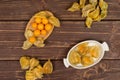 Fresh orange physalis on brown wood Royalty Free Stock Photo