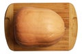 Fresh orange pumpkin with green veins on wooden board top view. Halloween preparation