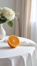 Fresh orange slice on white table with flowers and natural light Royalty Free Stock Photo
