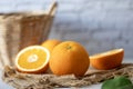 Fresh orange studio packshot with whtie brick background for citrus and summer fruit harvest concept