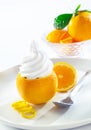 Fresh orange topped with twirling softserve