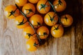 Fresh orange yellow tomatos cherry on wood table