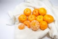 The fresh oranges are arranged on a white cloth background. Royalty Free Stock Photo
