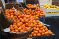 Fresh oranges in baskets at a fruit market Royalty Free Stock Photo