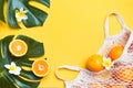 Fresh oranges in a eco bag. Cutted citrus fruit for healthly food. Royalty Free Stock Photo