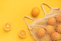 Fresh oranges in a eco bag. Cutted citrus fruit for healthly food.