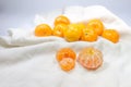 Fresh Oranges fruit arranged on white fabric as background. Royalty Free Stock Photo