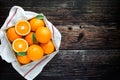 Fresh oranges fruit in wooden basket. Pile of oranges top view Royalty Free Stock Photo