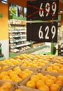 Fresh oranges in grocery with discounts