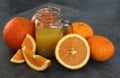 Orange juice and fresh fruits on a table Royalty Free Stock Photo