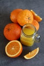 Orange juice and fresh fruits on a table Royalty Free Stock Photo