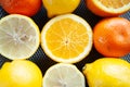 Fresh oranges and lemons in a tray on a table, top view. Citrus fruit concept Royalty Free Stock Photo