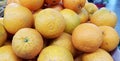 Fresh oranges lie on the supermarket counter, close-up Royalty Free Stock Photo