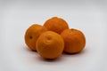Four fresh tangerines with a white background