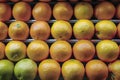 Fresh oranges ready to buy in supermarket, healthy snack Royalty Free Stock Photo