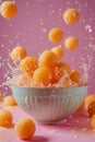 Fresh Oranges Splashing into Bowl on Pink Background Citrus Fruit, Refreshing Summer Concept