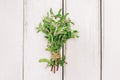 Fresh oregano bunch on the white table, aromatic herb