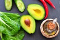 Fresh organic avocado, chili pepper, spinach, seasalt, olive oil, Royalty Free Stock Photo