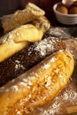 Fresh organic baguettes arranged on cutting board