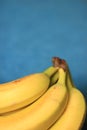 Fresh Organic Bananas on blue background