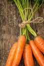 Fresh Organic Carrots on wooden background