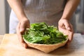 Fresh organic chayote shoot leaf in a basket