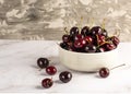 Fresh organic cherry fruit in bowl, rustic background. healthy summer fruit.