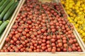 Fresh organic cherry tomatoes, selectiv focus on farmers market counter, pile of live vitamins. Vegeterian food, harvest