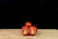 Fresh organic cherry tomatoes on wood Royalty Free Stock Photo