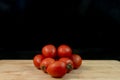 Fresh organic cherry tomatoes on wood Royalty Free Stock Photo