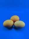 Fresh organic chicken eggs on a blue background Royalty Free Stock Photo