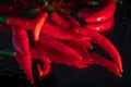 Fresh Organic Chili Peppers With Reflection On Shiny Black Background