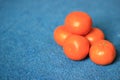 Fresh Organic Clementines on blue background