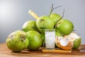 Fresh coconut juice with its meat and a bunch of coconuts. Royalty Free Stock Photo
