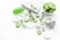 Fresh organic cosmetics with cucumber. Cream and lotion on white background copyspace