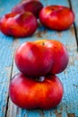 Fresh organic flat nectarines on an old wooden background Royalty Free Stock Photo