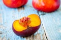 Fresh organic flat nectarines on an old wooden background Royalty Free Stock Photo