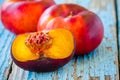 Fresh organic flat nectarines on an old wooden background Royalty Free Stock Photo