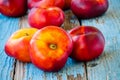 Fresh organic flat nectarines on an old wooden background Royalty Free Stock Photo