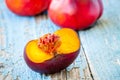 Fresh organic flat nectarines on an old wooden background Royalty Free Stock Photo